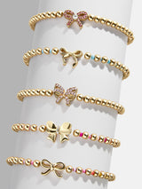 BaubleBar Better Together Kid's Bracelet Set - Bow - 
    Five gold beaded stretch bracelets
  
